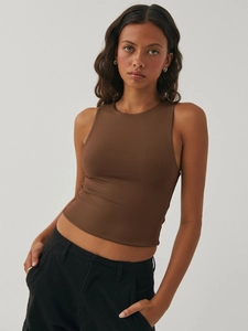 Detail of brown ribbed sleeveless tank top texture and fit on a studio model
