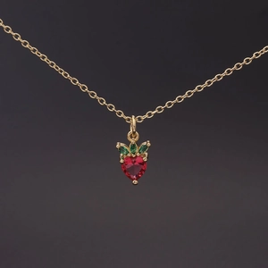 Zircon strawberry pendant necklace in gold finish with red heart stone and green leaves