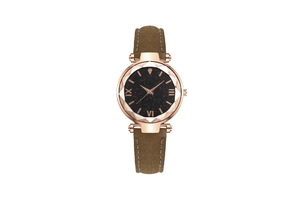 Detail of starry black dial with faceted glass and rose gold case on a brown suede strap