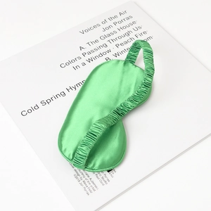 Green silk sleep eye mask for men and women featuring light blocking design and elastic band