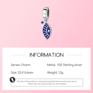 Macro detail of S925 sterling silver evil eye charm with blue enamel and zircon inlay