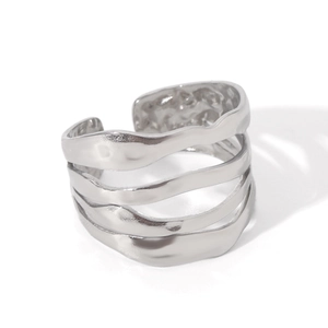 Detail of silver irregular wave textured multilayer open ring with hammered finish