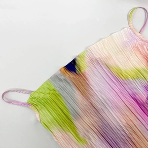 Detailed view of the fine vertical pleats and colorful rainbow gradient on the slim camisole