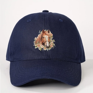 Detailed close-up of dark blue cotton baseball cap with printed horse and floral design