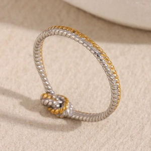 Two-tone 18K gold plated stainless steel twisted rope ring with a knot design