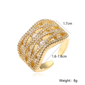 Detail showing 1.7cm wide 18K gold plated ring with wave texture and cubic zirconia