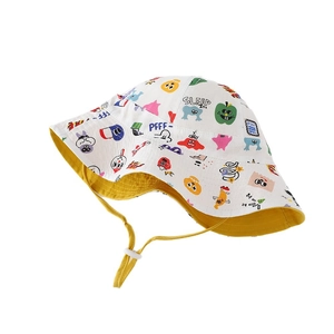Reversible cartoon monster print bucket hat for toddlers with adjustable yellow chin strap