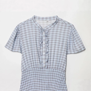 Short plaid puff sleeve dress in blue and white with ruffled front and button details