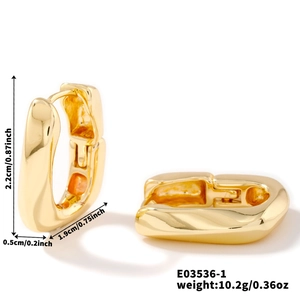 Detailed view of polished golden U-shaped earrings with dimensions 2.2cm by 1.9cm