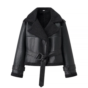 Detail of black shearling biker jacket texture with plush lining and leather belt