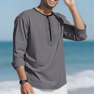 Men's casual linen long sleeve Henley shirt in grey color with beach scenery background