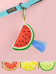 Close-up of fruit-shaped pet waste bag dispensers with watermelon and lemon designs