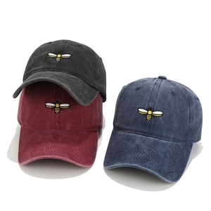 Washed cotton baseball caps with bee embroidery in black, burgundy and navy colors