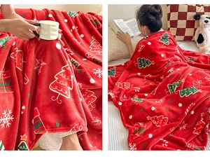 Detail of red Christmas flannel blanket with festive snowflake patterns in cozy bedroom