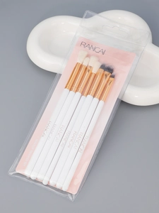 Close-up of 8 RANCAI eye makeup brushes with white handles and gold ferrules on cloud prop