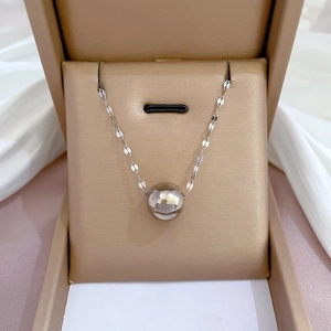 Silver round pendant necklace with flat chain links displayed in a premium gold gift box