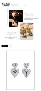 Detail of 18K gold-plated heart pendant earrings showing vacuum plating texture