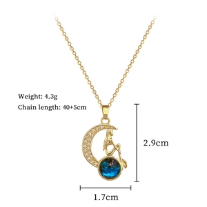 Macro detail of crescent moon pendant with zircon inlay and product specifications
