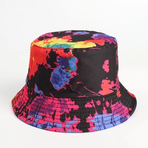 Detailed view of reinforced brim stitching on a black tie-dye splatter bucket hat