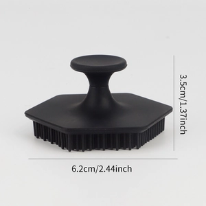 Black silicone facial exfoliating brush with hexagonal base and ergonomic handle