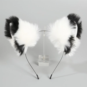 Detail of plush black and white faux fur cat ears on a slim metal headband for cosplay