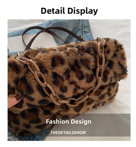 Detail of leopard print faux fur handbag with dark brown strap and resin chain link