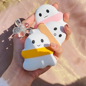 Three cute cartoon ghost hand warmers in yellow orange and pink with soft matte finish