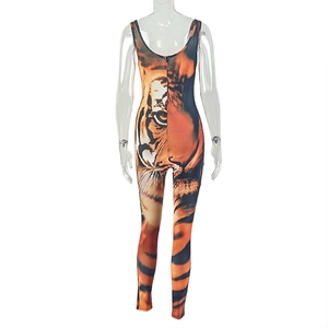 Detail of tiger print jumpsuit featuring orange black stripes and high stretch fabric