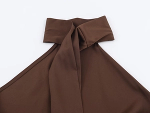 Detailed close-up of dark brown halter top neckline with elastic texture and clean seams
