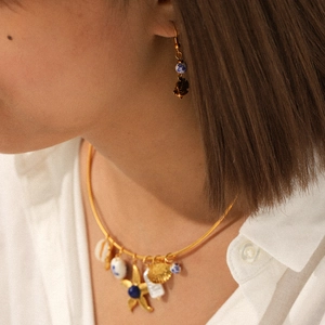Ocean style stainless steel necklace set with ceramic heart charms and starfish detail