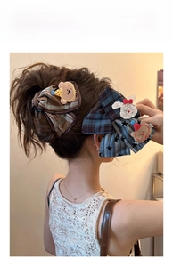 Model wearing large plaid hair clips with cute bear and rabbit cartoon embroidery patches
