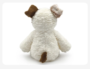 Detail view of the soft plush puppy toy showing cream and brown faux fur texture