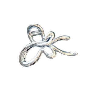 Silver metallic hair claw clip with trendy abstract fluid lines for minimalist styling