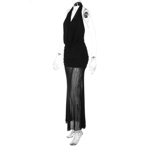 Close-up of black mesh skirt detail with sheer texture and ruched waist design