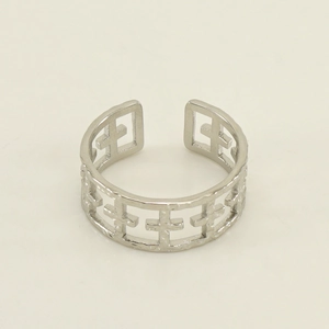 Detailed close-up of silver hollowed cross pattern on a titanium steel open ring