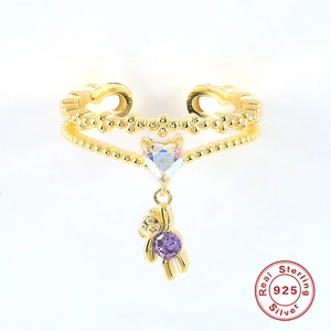 Detail of S925 sterling silver adjustable ring with pink heart and bear charm pendants