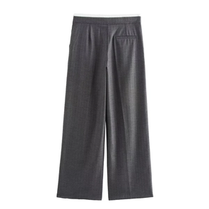 Detail of high-waist wide-leg pants in grey herringbone fabric with a back pocket