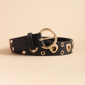 Close-up of black faux leather belt with golden heart-shaped eyelets and D-ring buckle