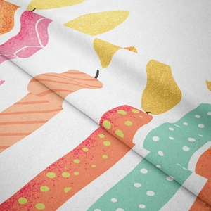 Close-up detail of bohemian tapestry fabric showing cute hand-drawn candle patterns