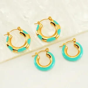 Two pairs of gold stainless steel hoop earrings with tiffany blue enamel accents
