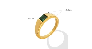 Macro detail of 18K gold plated ring with emerald green zircon and 0.5cm band width