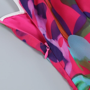 Macro detail of high-quality floral print fabric with a pink invisible zipper closure