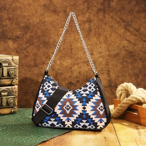 Aztec bohemian hobo bag featuring geometric print with silver chain and wide strap detail