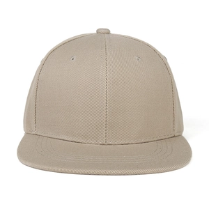 Close-up of khaki flat brim baseball cap showing twill fabric texture and stitching