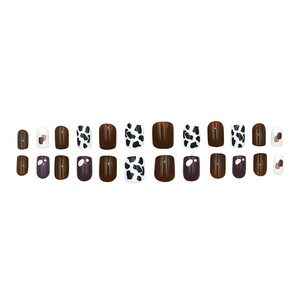 24-piece press-on nail set featuring nude tones, cow print, and abstract patterns