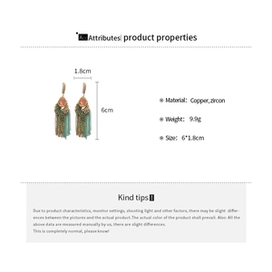 Detail of vintage teardrop earrings with pink zircon and tassels, size 6cm x 1.8cm