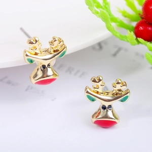 Macro shot of reindeer head studs with colorful enamel finish on a white festive tray