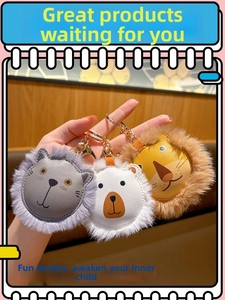 Detail of cute plush lion and bear leather keychains in grey, white and brown colors