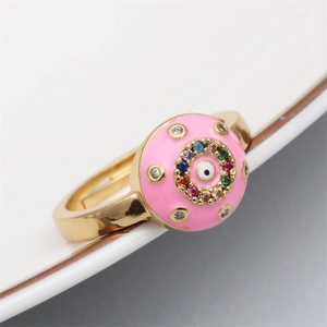Detailed close-up of pink enamel Evil Eye ring with colorful zircons and gold plating