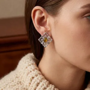 Tiger eye stone earrings in a retro hollow diamond-shaped silver filigree design